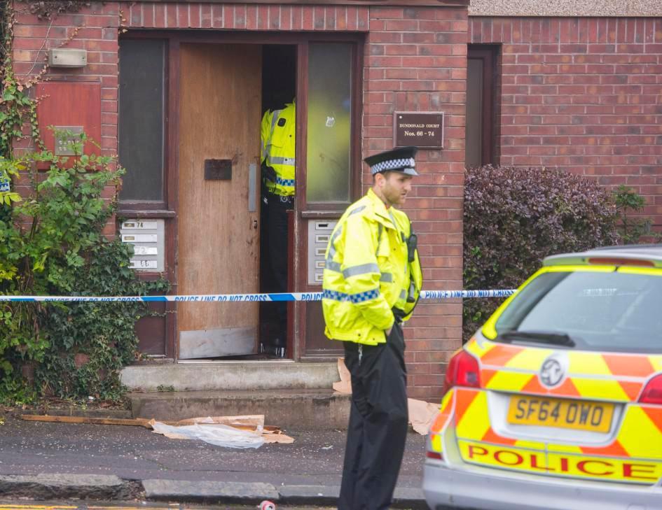  Cops at the scene of the bloodbath party attack in Dundee yesterday