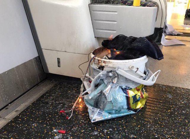  Wires can been seen hanging out of bucket inside a carrier bag