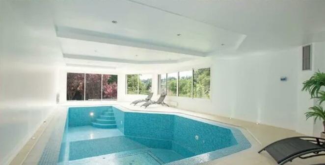  The huge indoor swimming pool is just one of many stunning features in the property