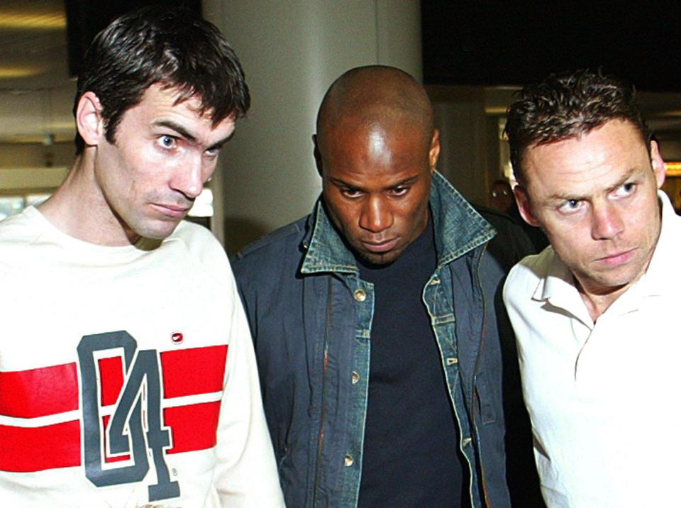  Leicester City soccer players Frank Sinclair (C), Keith Gillespie (L), and Paul Dickov (R) check in at Alicante Airport for their flight back home after being wrongly accused