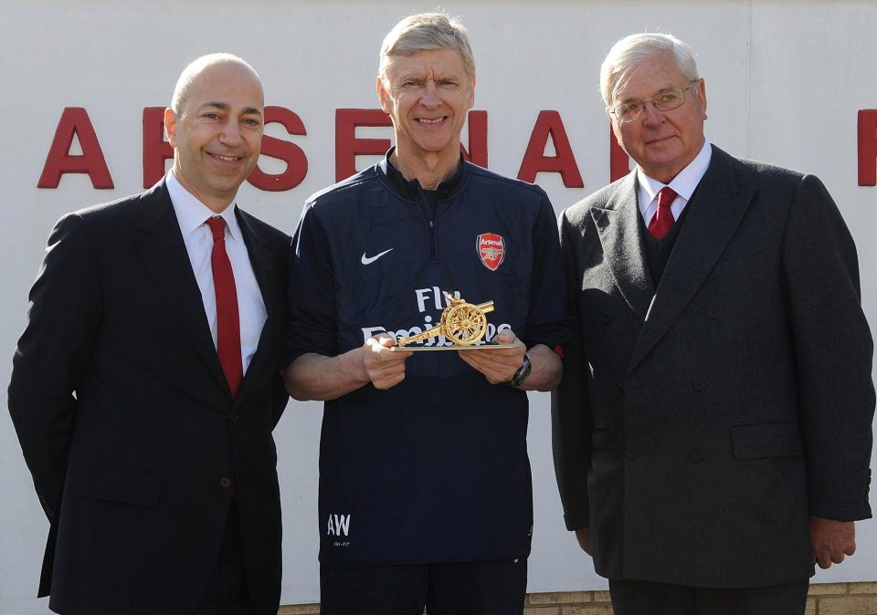  Chairman Sir Chips Keswick and CEO Ivan Gazidis present Arsene Wenger with a gold cannon to commemorate his 1000th game as Arsenal manager