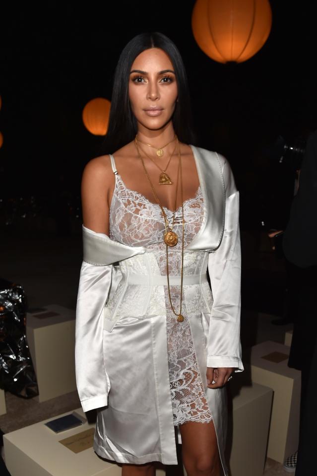  Kim attending the Givenchy show at Paris Fashion Week just hours before the incident