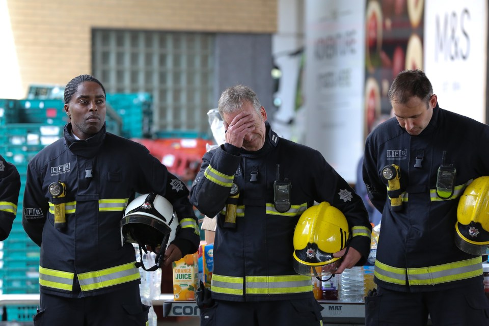 Fire crew weep at the aftermath of the Grenfell Tower blaze back in June 