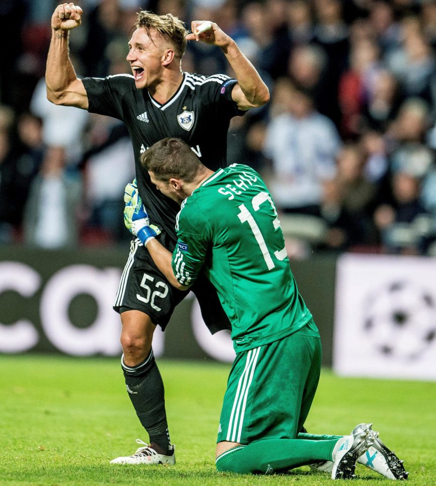  Qarabag keeper Ibrahim Sehic and team-mate Jakub Rzezniczak celebrate beating FC Copenhagen in the play-offs to reach the group stages of the Champions League