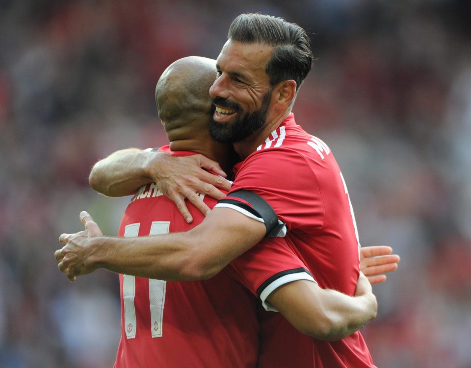  Ruud van Nistelrooy is congratulated on his opener by striker partner Danny Webber