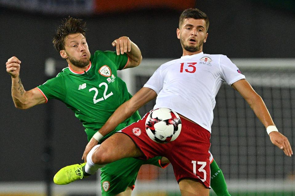  Harry Arter vies with Georgia's Giorgi Kvilitaia (R) during the 2018 World Cup qualifier