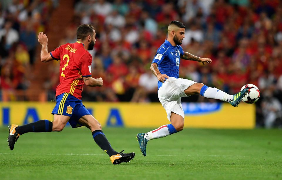  Spain defender Dani Carvajal watches Italy forward Lorenzo Insigne lunge into action