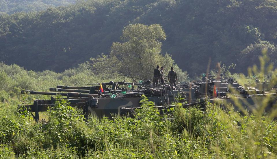  South Korean army soldiers prepare on K-9 self-propelled howitzers