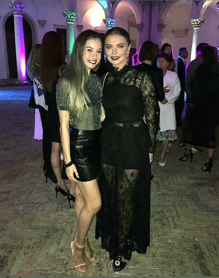 Alina, who has not been linked to any other suitors since 2008, poses with a fan