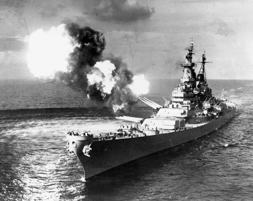 The giant U.S. battleship Missouri ("Mighty Mo") firing a broadside of her great 16-inch guns when it saw action off the coast of Korea