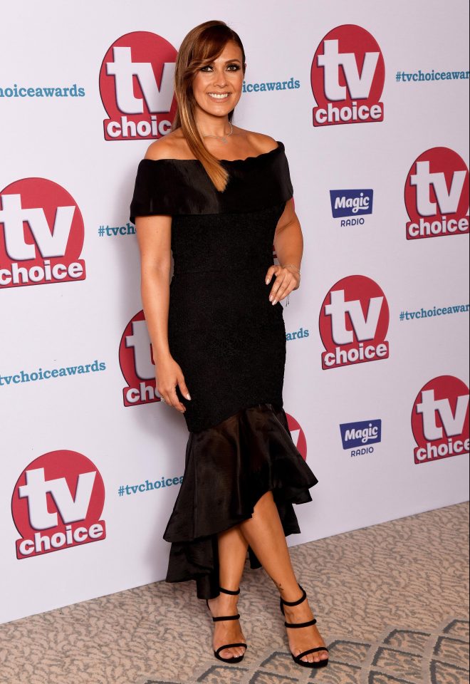  While Kym Marsh chose a classic black dress with a ruffled hem