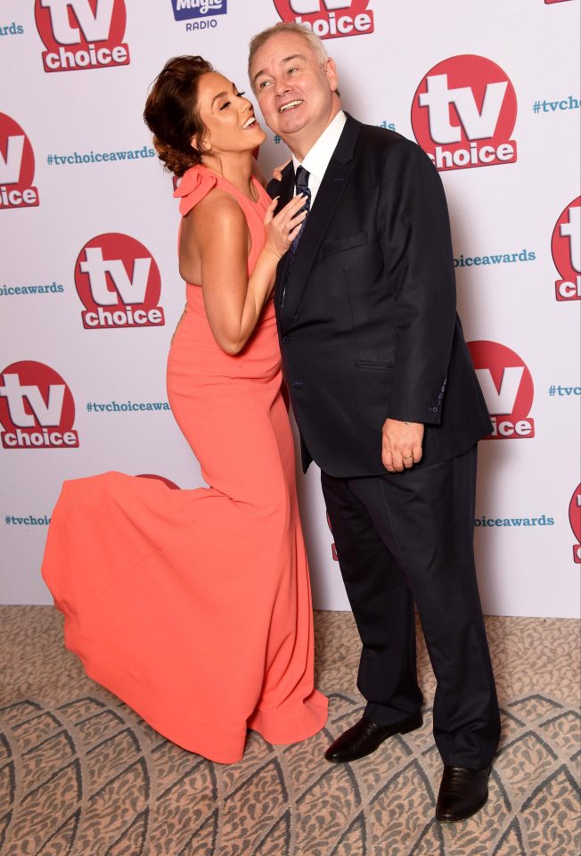  But Vicky couldn't resist placing a kiss on her pal Eamonn Holmes cheek in one snap