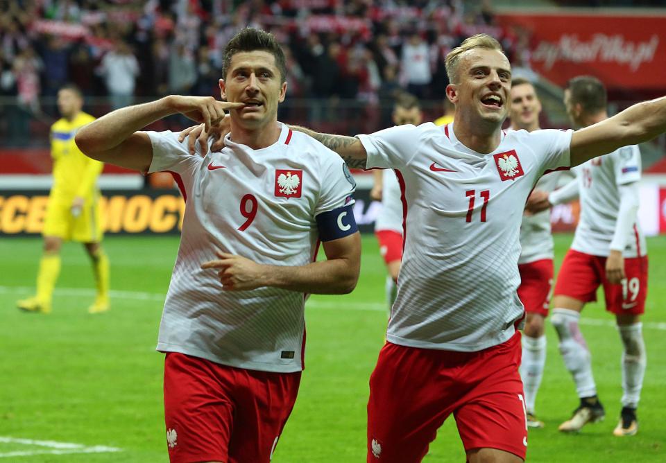  Lewandowski celebrates after scoring from the penalty spot for Poland