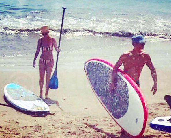 Katy Perry followed beau Orlando Bloom out of the sea today but the actor had his swimming trunks firmly on