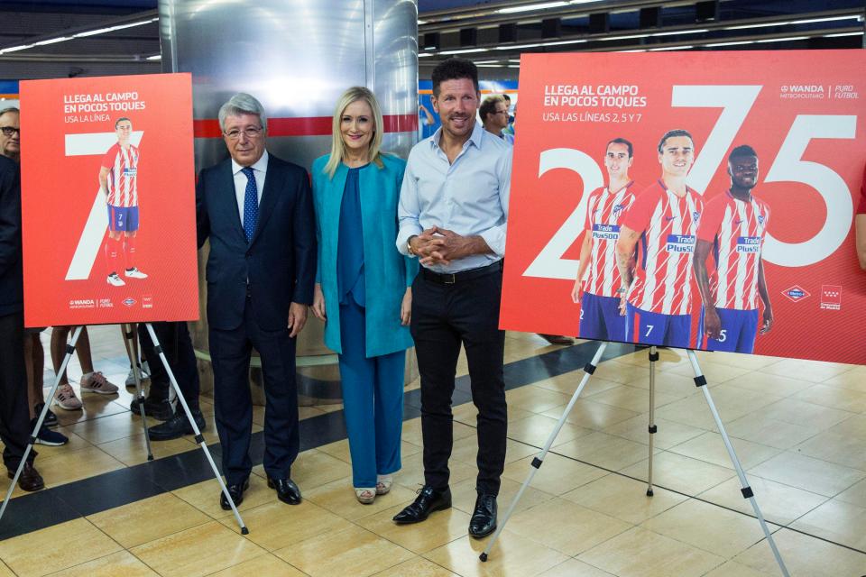  Atletico president, Enrique Cerezo, left,, manager Diego Simeone, right,, are joined by the regionial President of Madrid, Cristina Cifuentes at the plush new ground