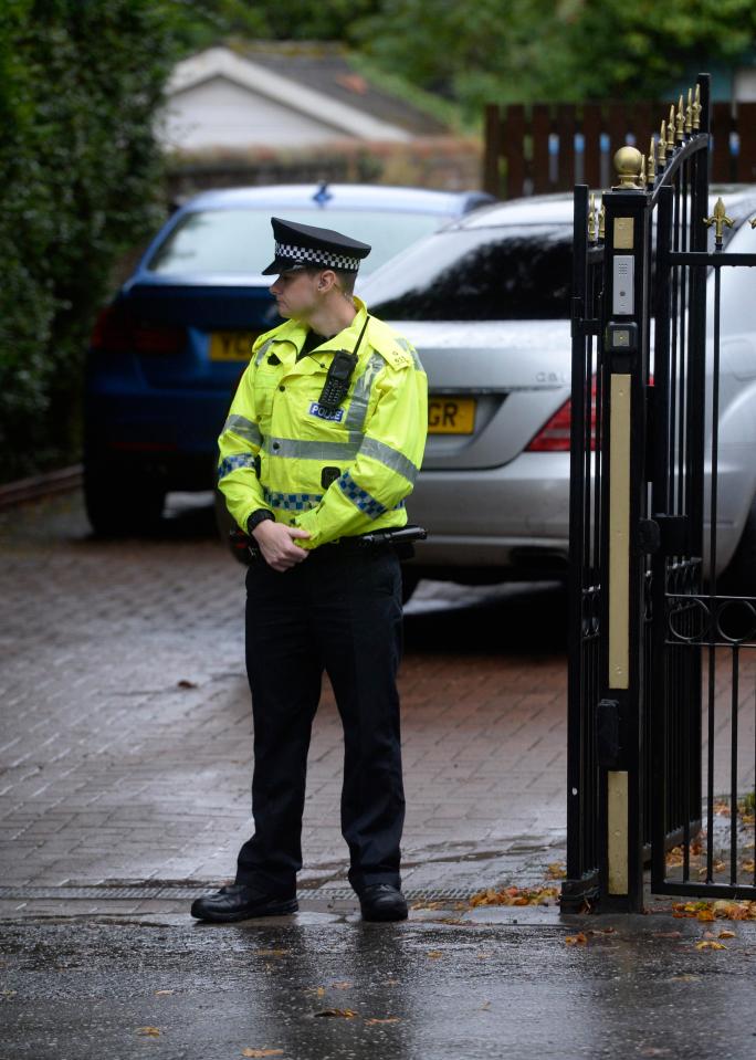  A police officer stands guard at the scene