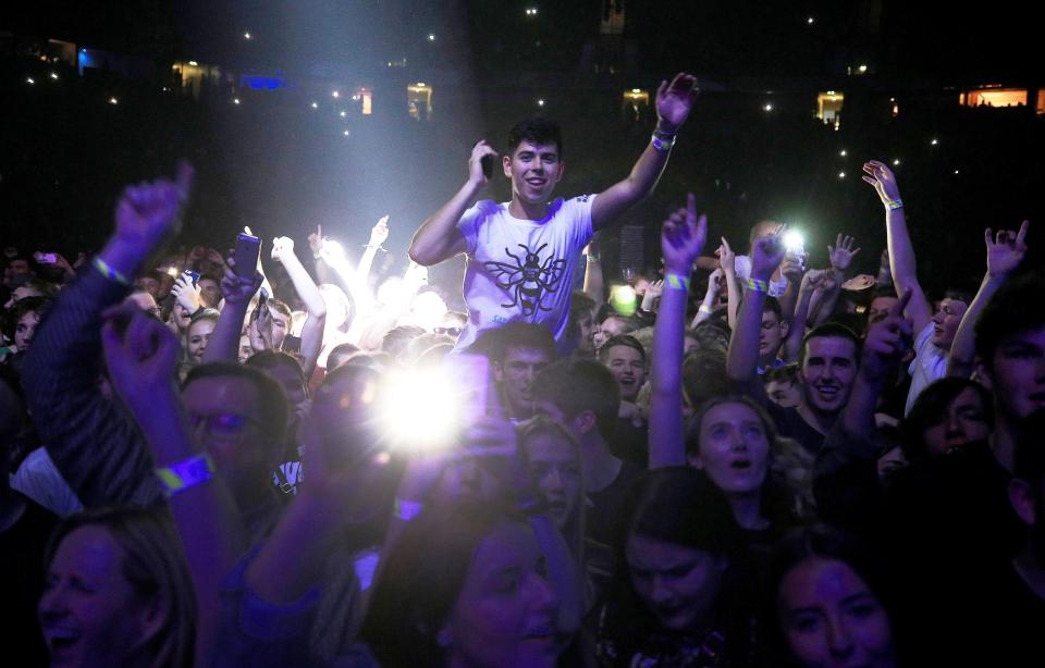  Crowds cheer as they are entertained by performers including Pixie Lott, Rick Astley and Bugzy Malone