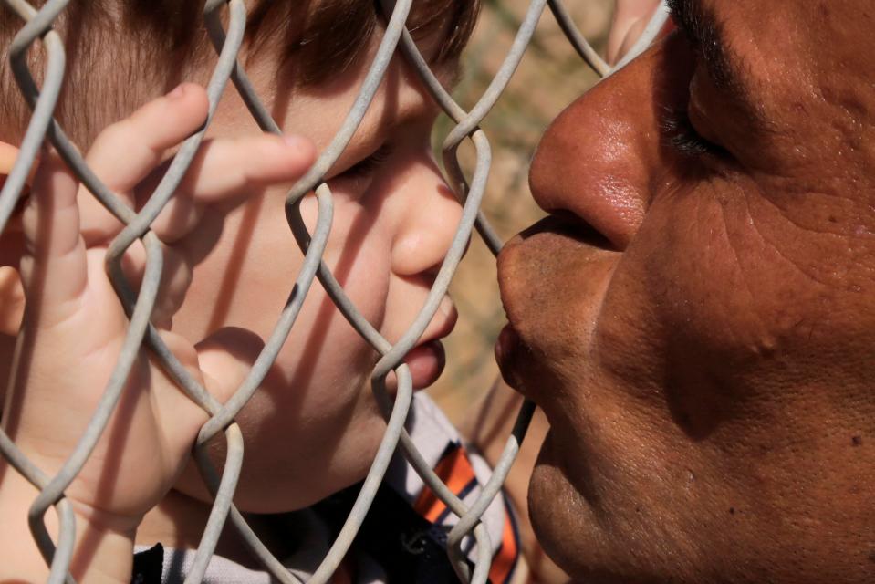  Ammar Hammasho from Syria kisses his children who arrived at the refugee camp in Cyprus