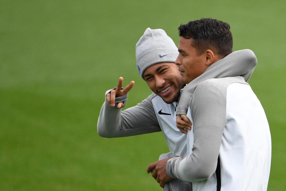  Mega-money man Neymar wraps his arm around the neck of fellow Brazilian Thiago Silva during training