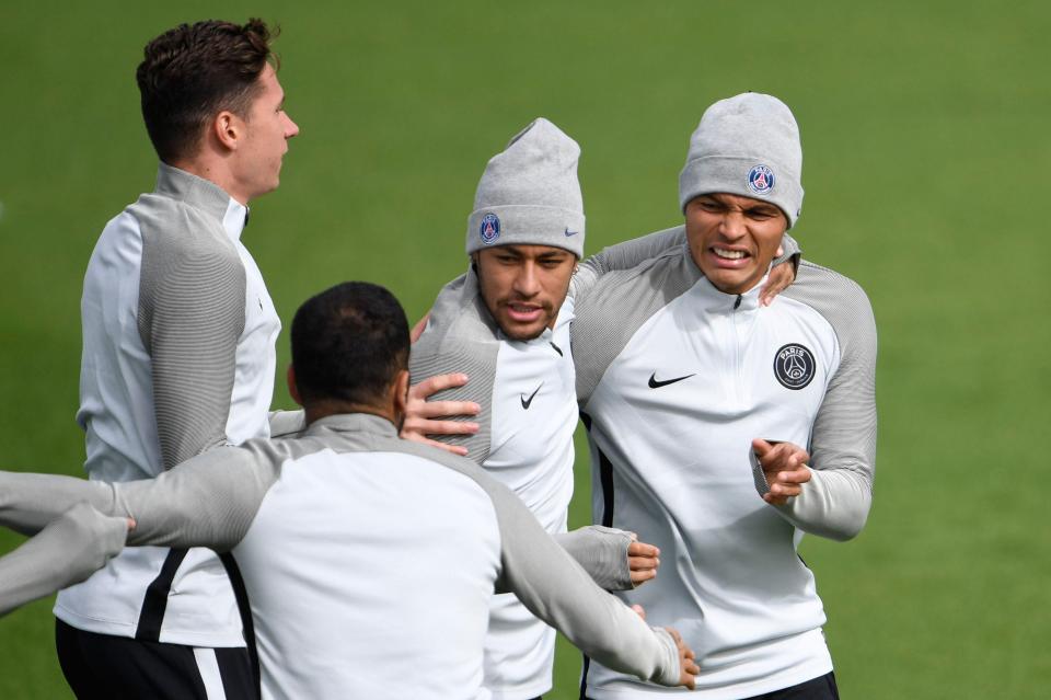  Neymar and Silva share a joke with team-mates during training session