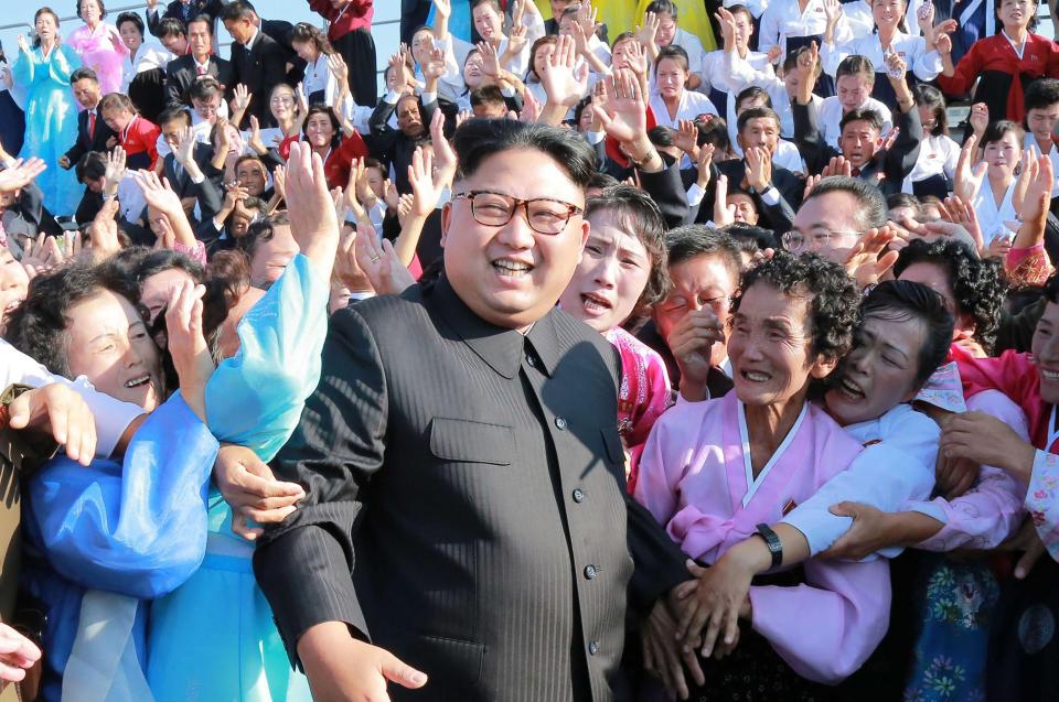  Kim Jong-Un attending a photo session with teachers who volunteered to work at branch schools on islands and schools in forefront line and mountainous areas, in Pyongyang