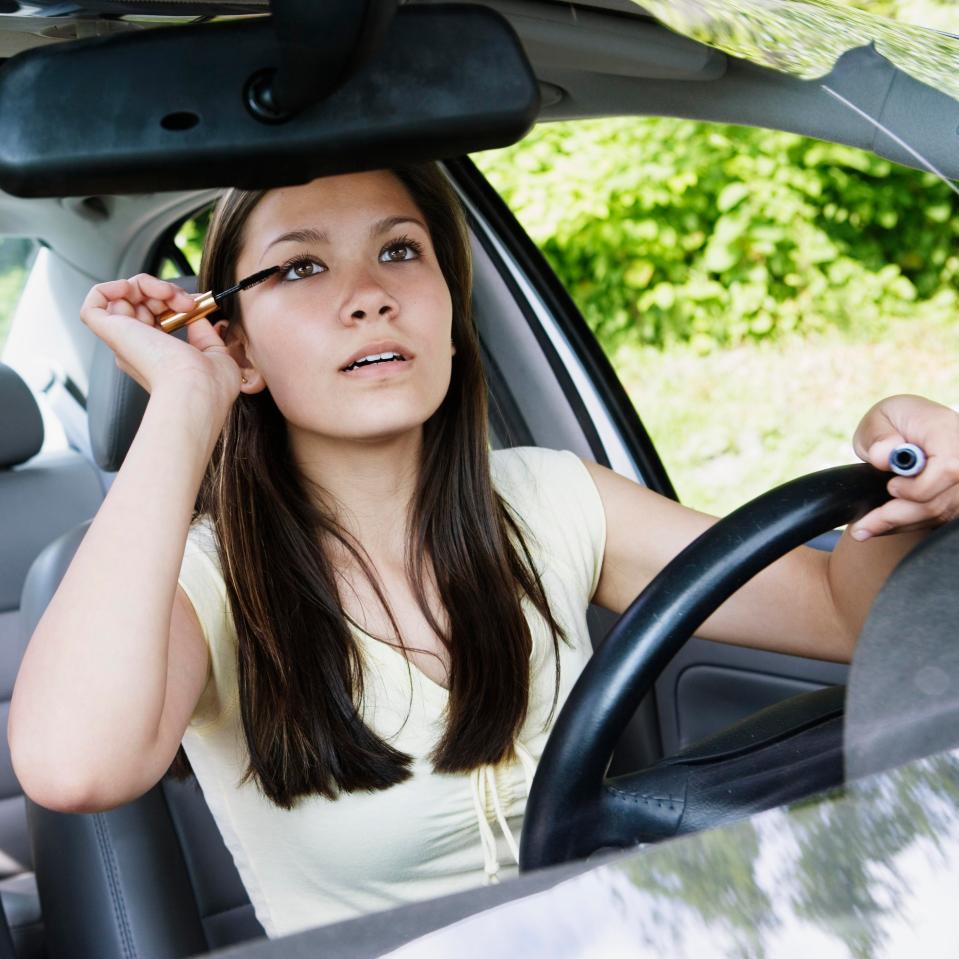  Drivers who apply makeup at the wheel may also be breaking the law