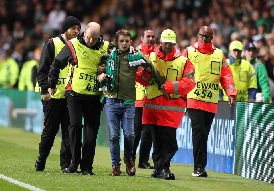  The fan was escorted away by stewards after invading the pitch and approaching Kylian Mbappe