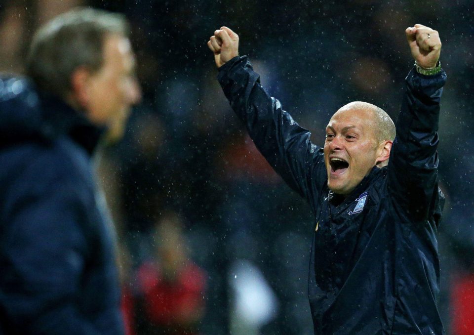  Alex Neil celebrates as Neil Warnock watches on