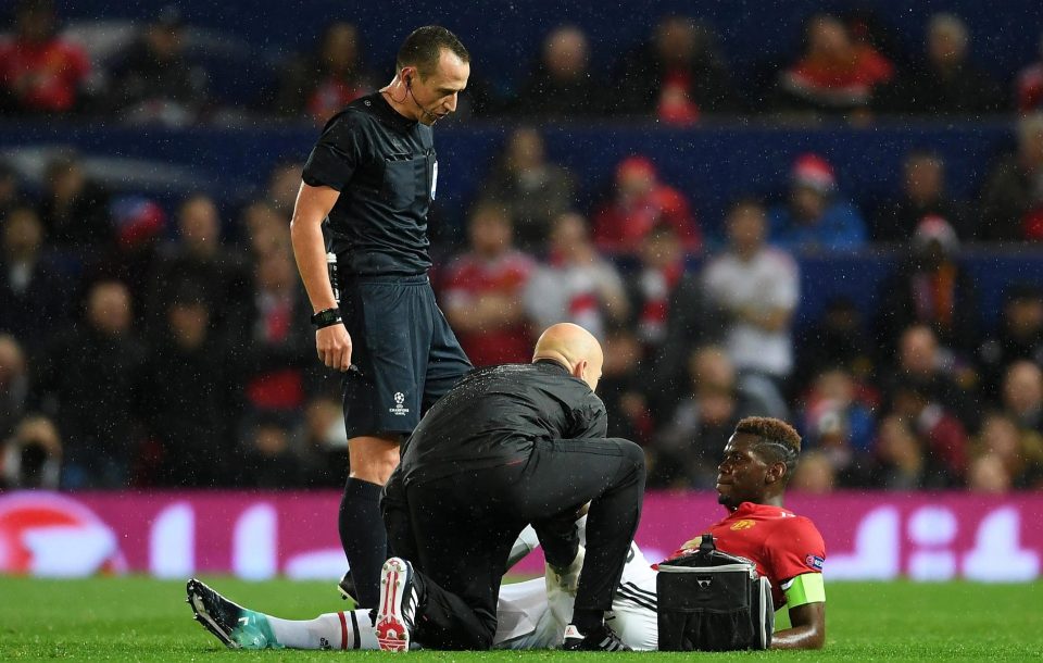  Paul Pogba receives treatment after picking up hamstring injury