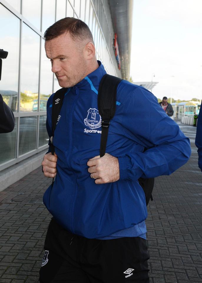  Wayne Rooney was seen yesterday at Liverpool's John Lennon airport showing off his wedding ring