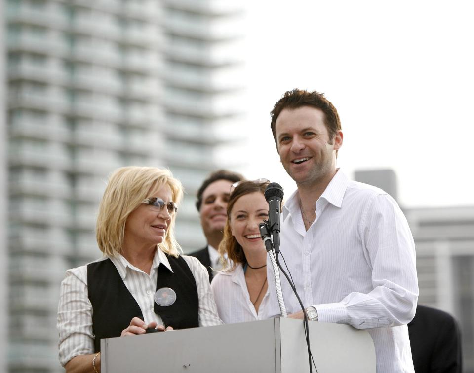  Yvonne Gibb, left, next to her children Samantha and Adam at a memorial for Maurice