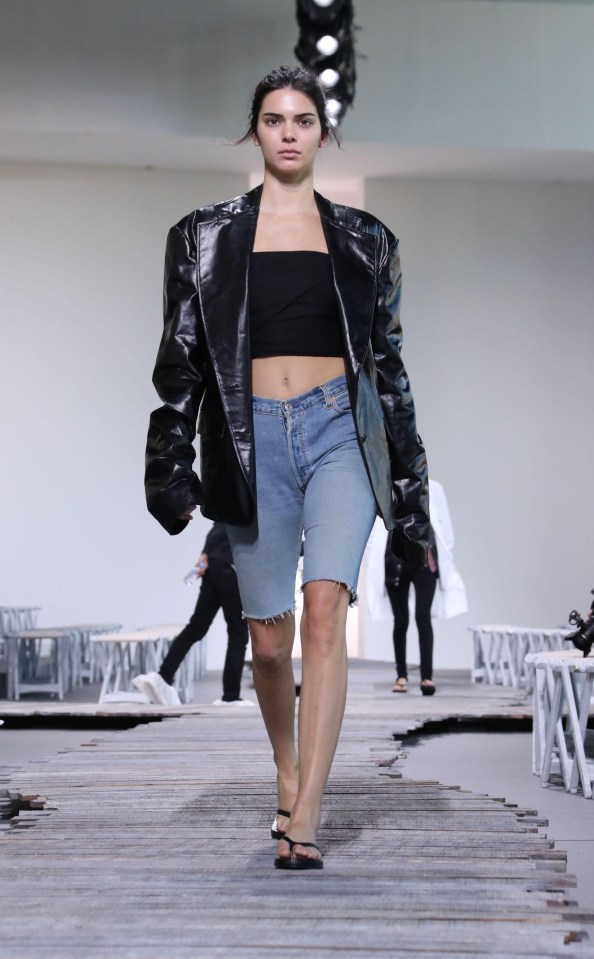 The model then switched into long line denim shorts and an oversized biker jacket