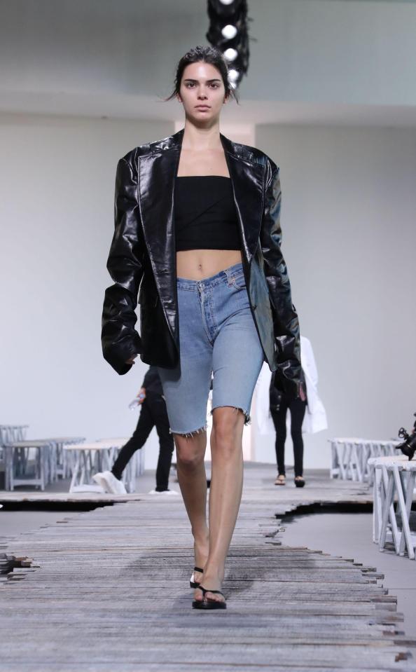  The model then switched into long line denim shorts and an oversized biker jacket