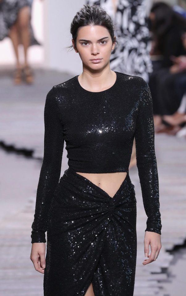  The model wore a black sparkly top and wrap skirt