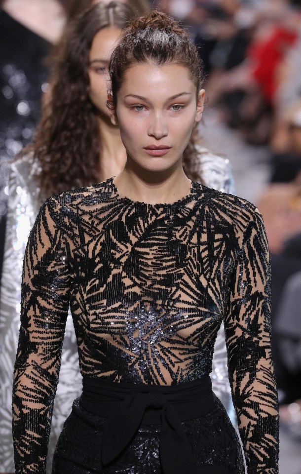 Bella wore a sheer top with black pattern covering her modesty