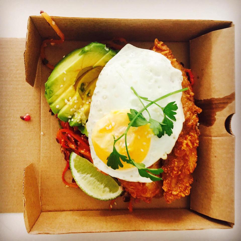  The Kentucky Protein Box includes a piece of original recipe chicken, an egg with sliced avocado on a bed of slaw