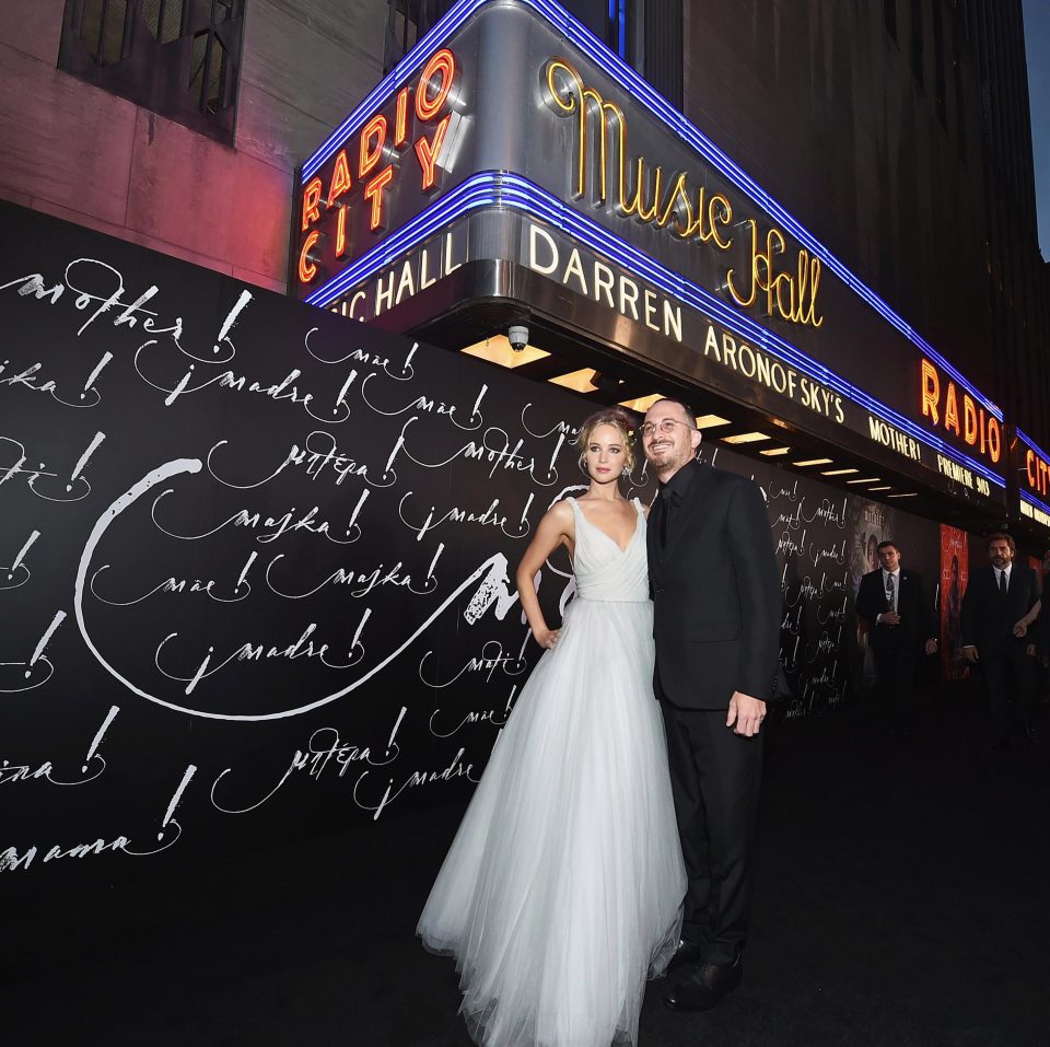  The couple smiled brightly outside the theatre