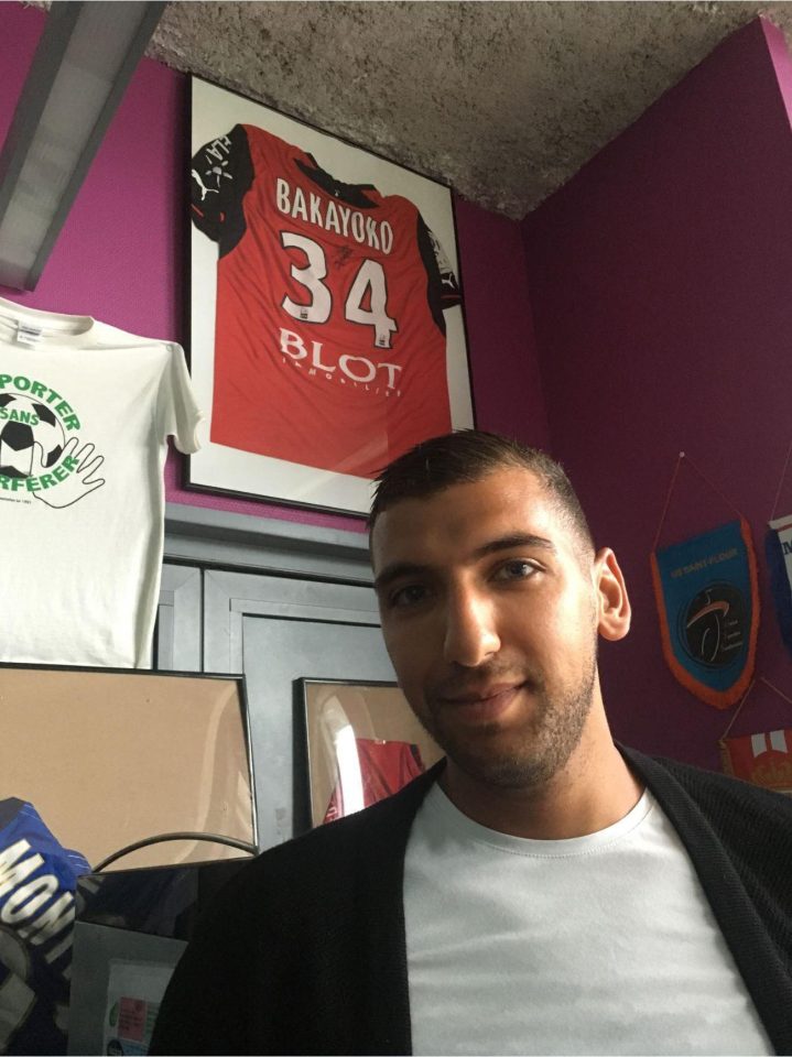  Ex-Montrouge team-mate Yacine Roussi poses in the clubhouse with a framed Bakayoko shirt