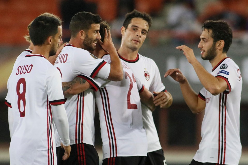 AC Milan players celebrate during 5-1 victory over Austria Vienna