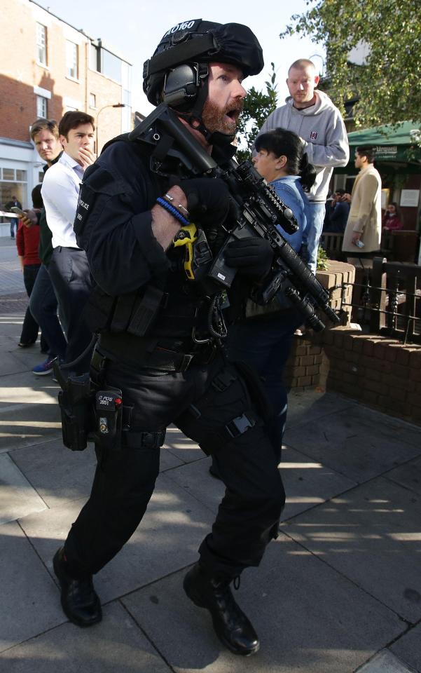  Armed cops rushed to the scene, where panicked commuters had fled from Parsons Green Station