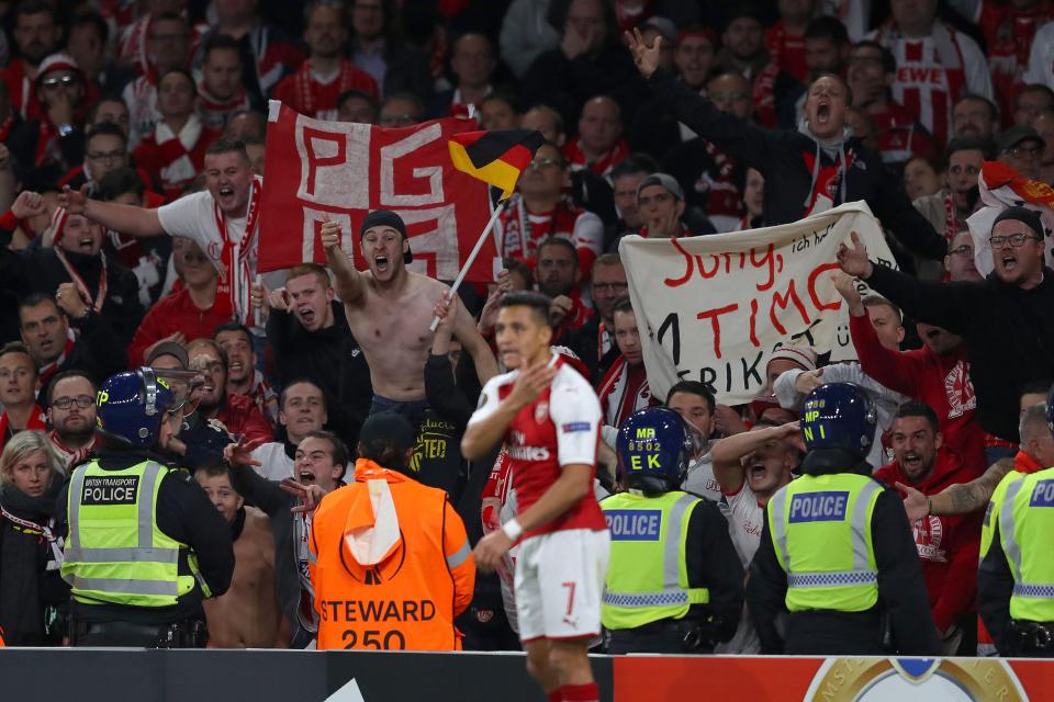  Mertesacker was trying to keep in touch with what was happening after Cologne fans attempted to force their way into the ground