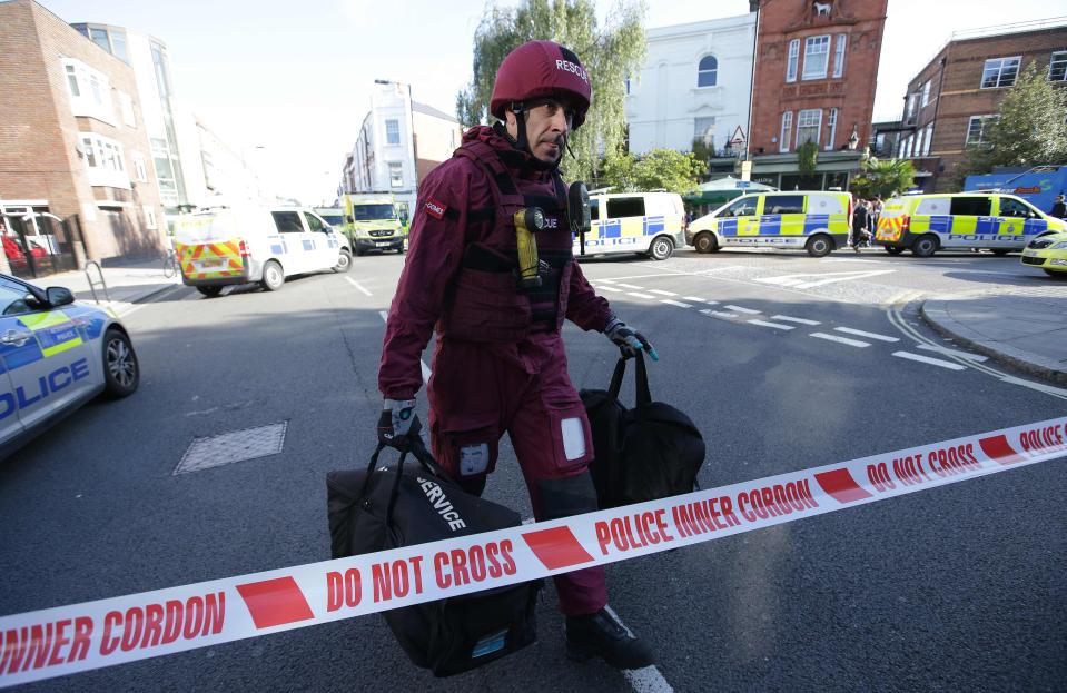  A police officer arrives at the cordon after the explosion