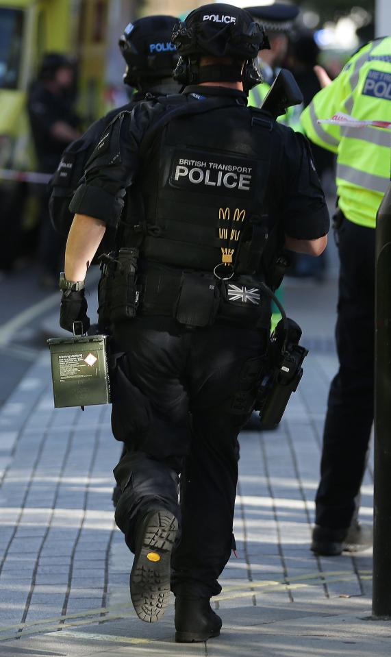  A British Transport Police officer is seen racing to the station