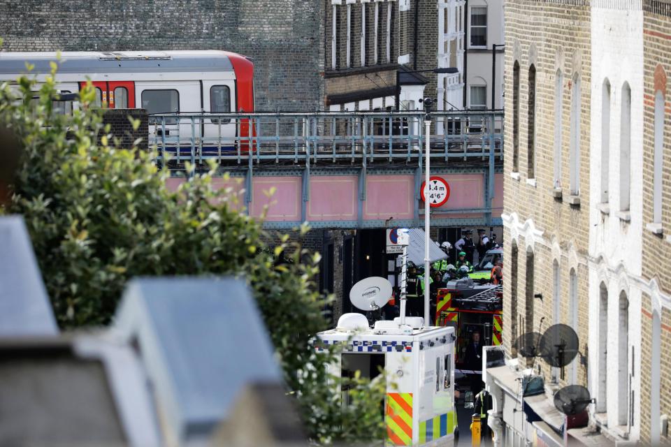 Police, fire and ambulance crews attend to an incident at Parsons Green tube station