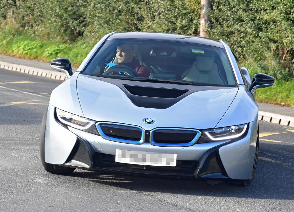  Rooney drove his £100,000 BMW i8 supercar for possibly the last time to training