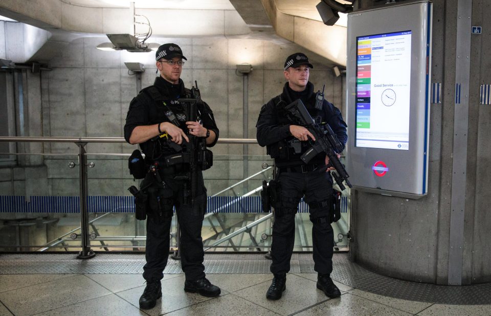  Met Police officers standing guard in Westminster Underground station today