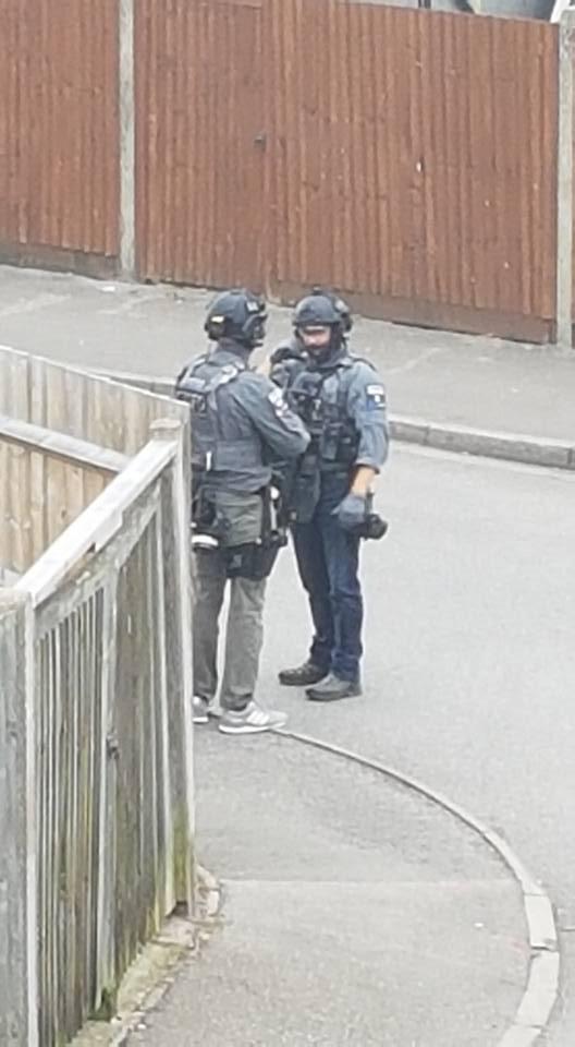  Cops on the quiet cul-de-sac as a raid was carried out