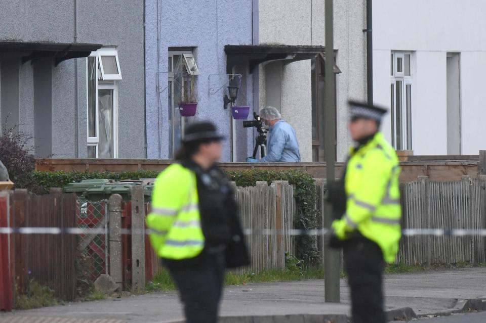  Police and forensic officers taking part in an operation in Sunbury-on-Thames, Surrey