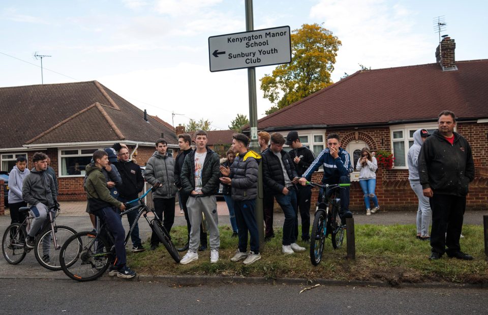  Onlookers watch as police search the Surrey home