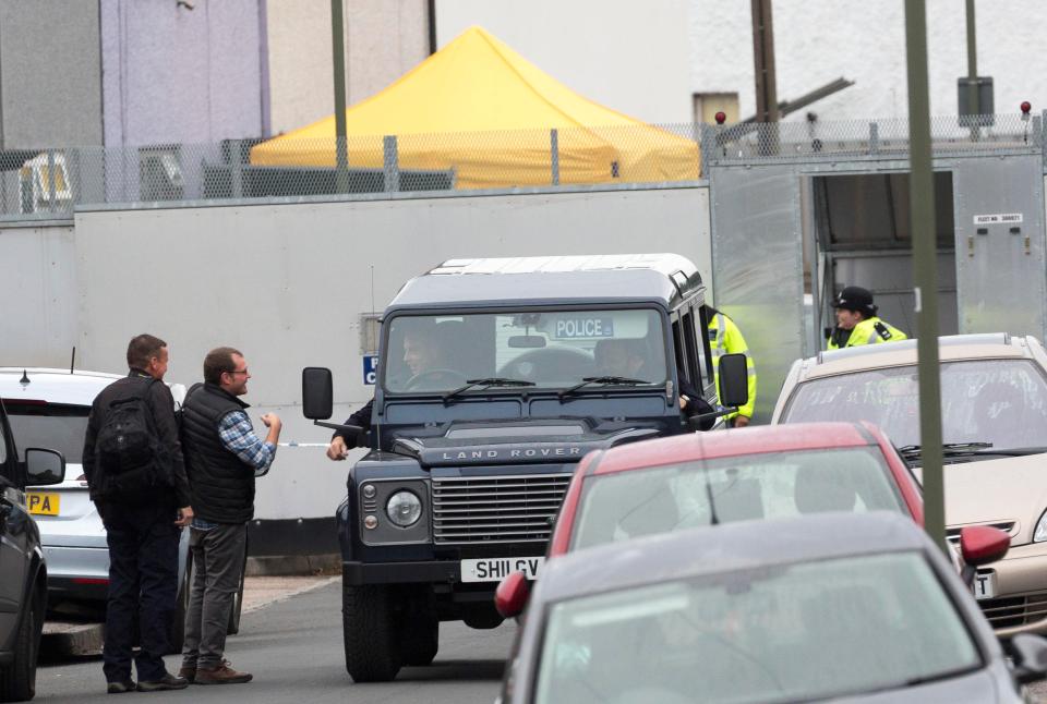  The whole road remains cordoned off and police have erected a large grey fence around the front of the Jones's home